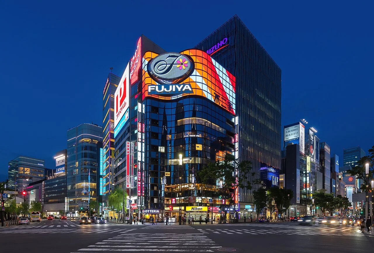 Illuminated Ginza street corner and Fujiya building