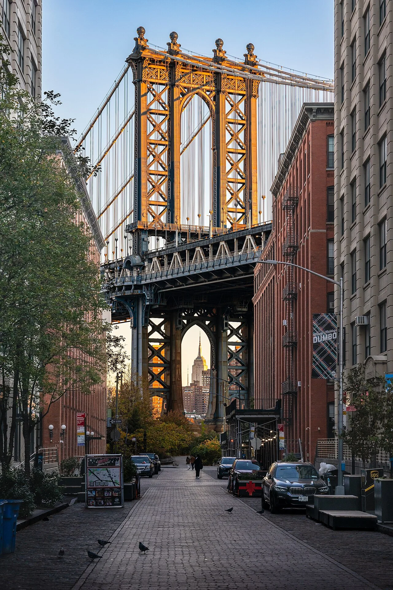Manhattan Bridge framed by buildings on Washington Street in DUMBO