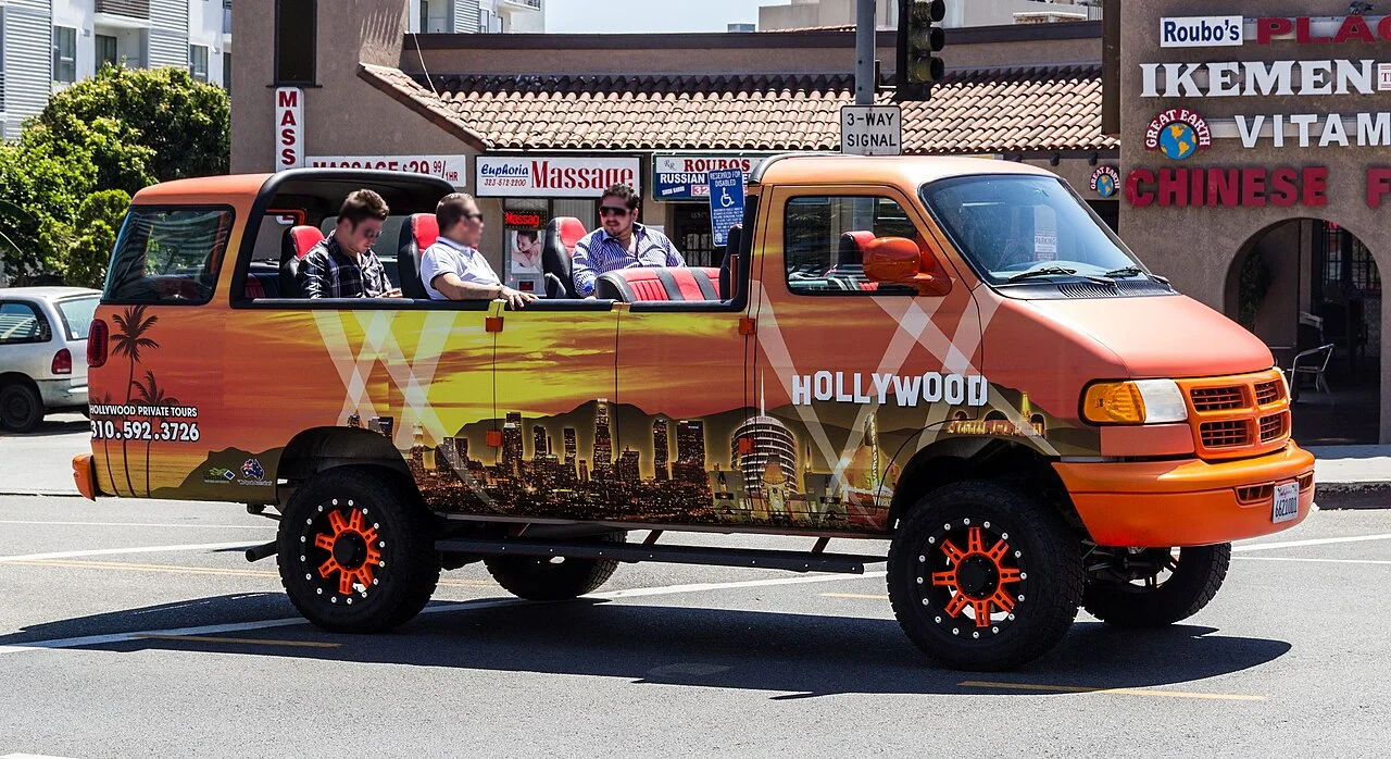 Hollywood Boulevard street scene with a sightseeing vehicle