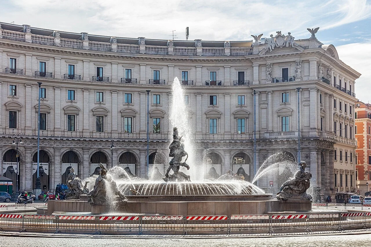 Anantara Palazzo Naiadi building behind the fountain in Piazza della Repubblica